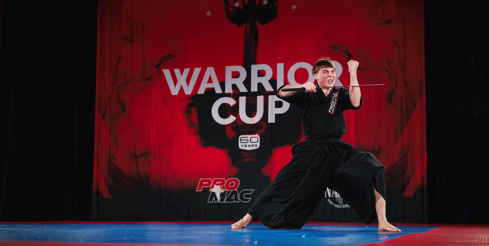 Sport karate weapons competitor performing at Warrior Cup